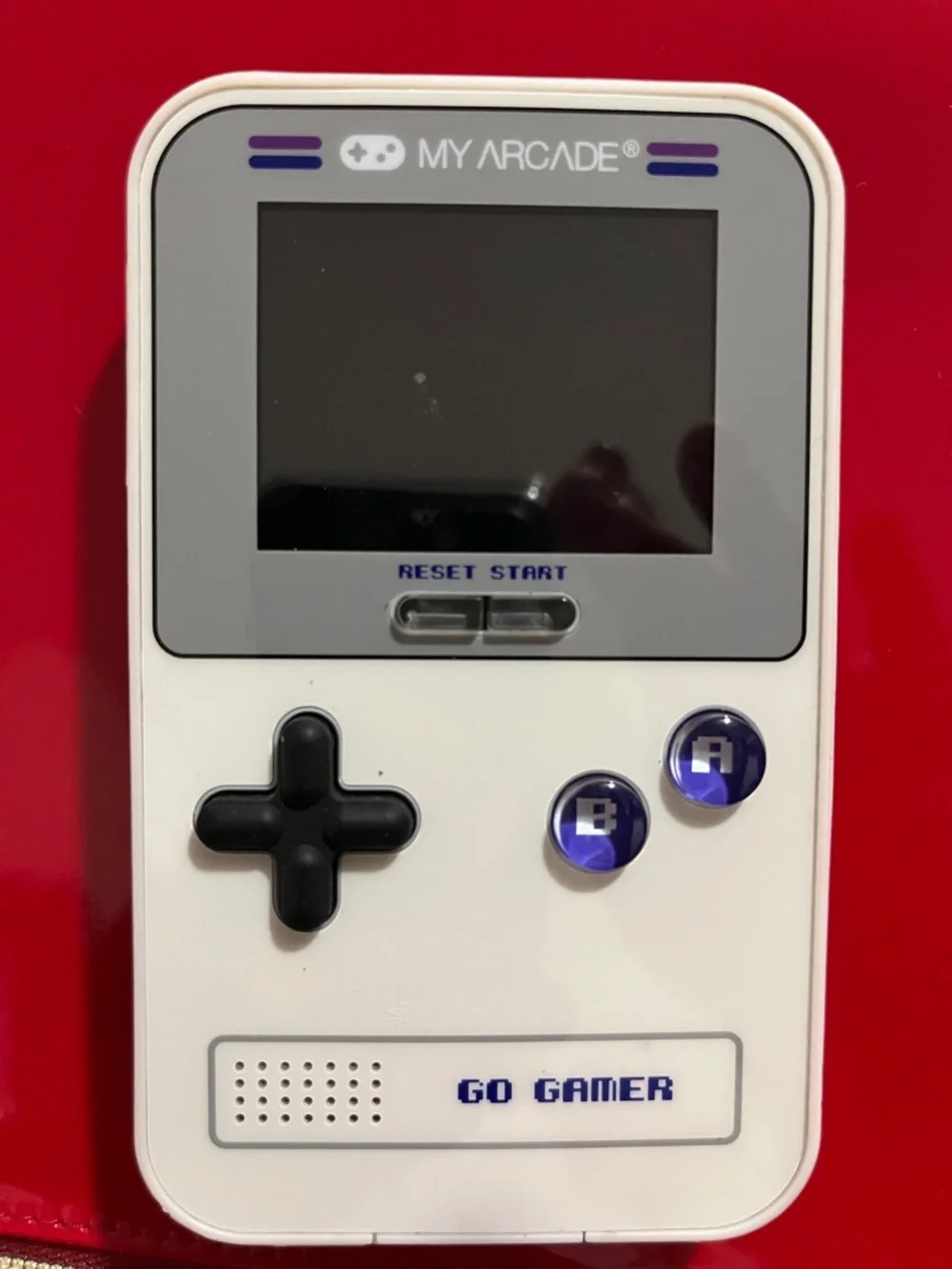Arcade GO GAMER White Handheld Console with Black D-pad and Purple Buttons